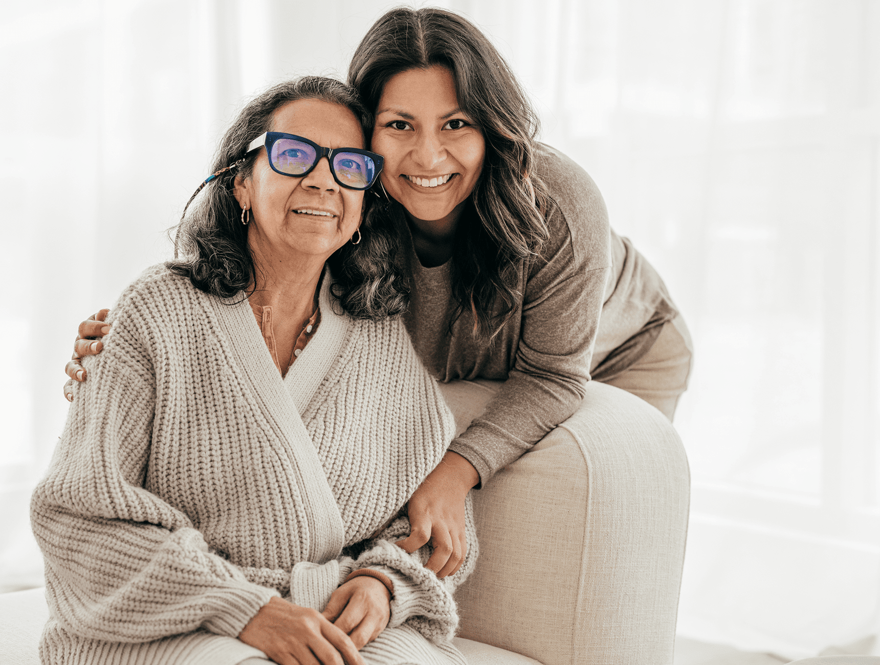 Mother and daughter smiling together