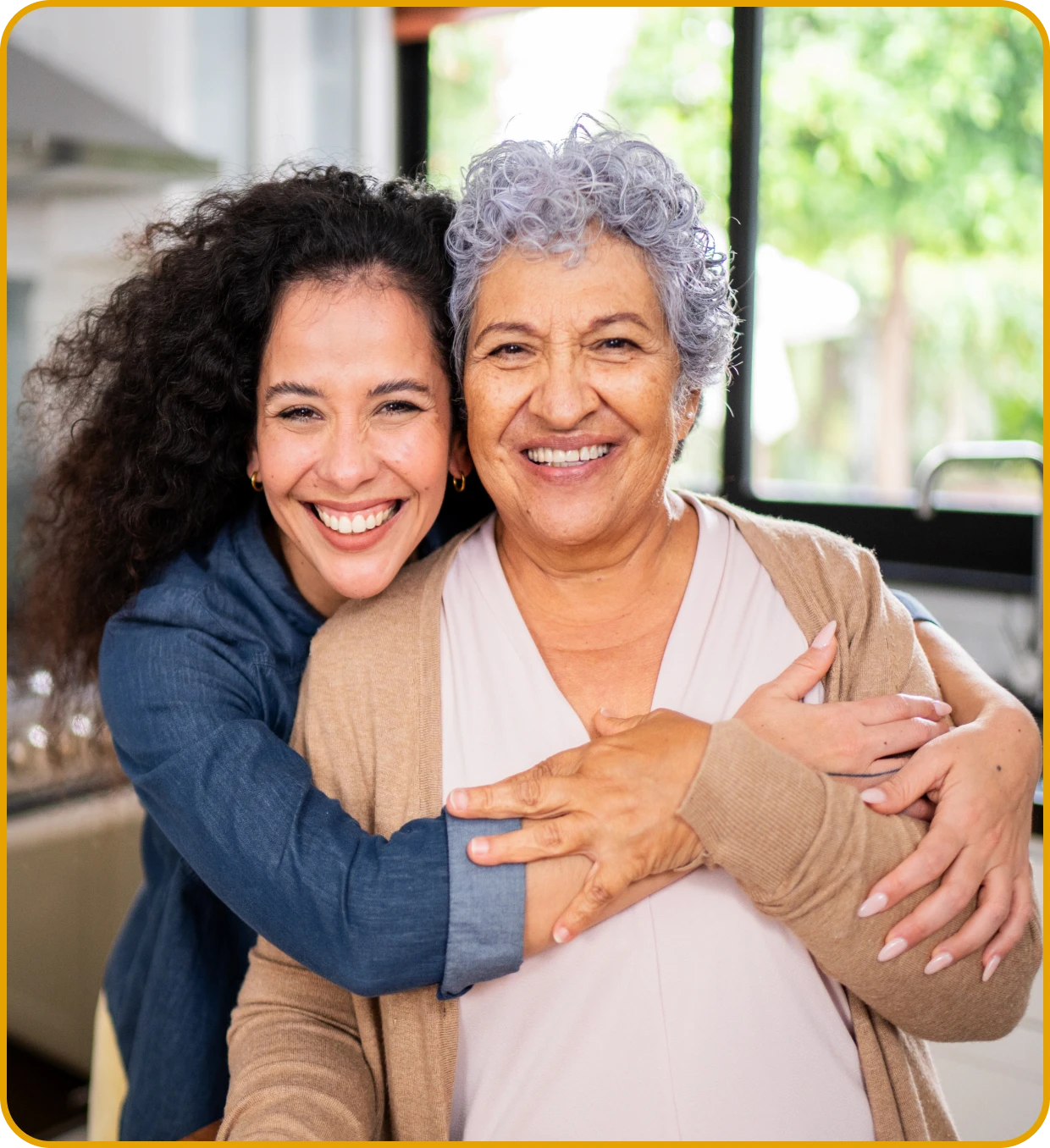 Smiling woman hugging elderly mother