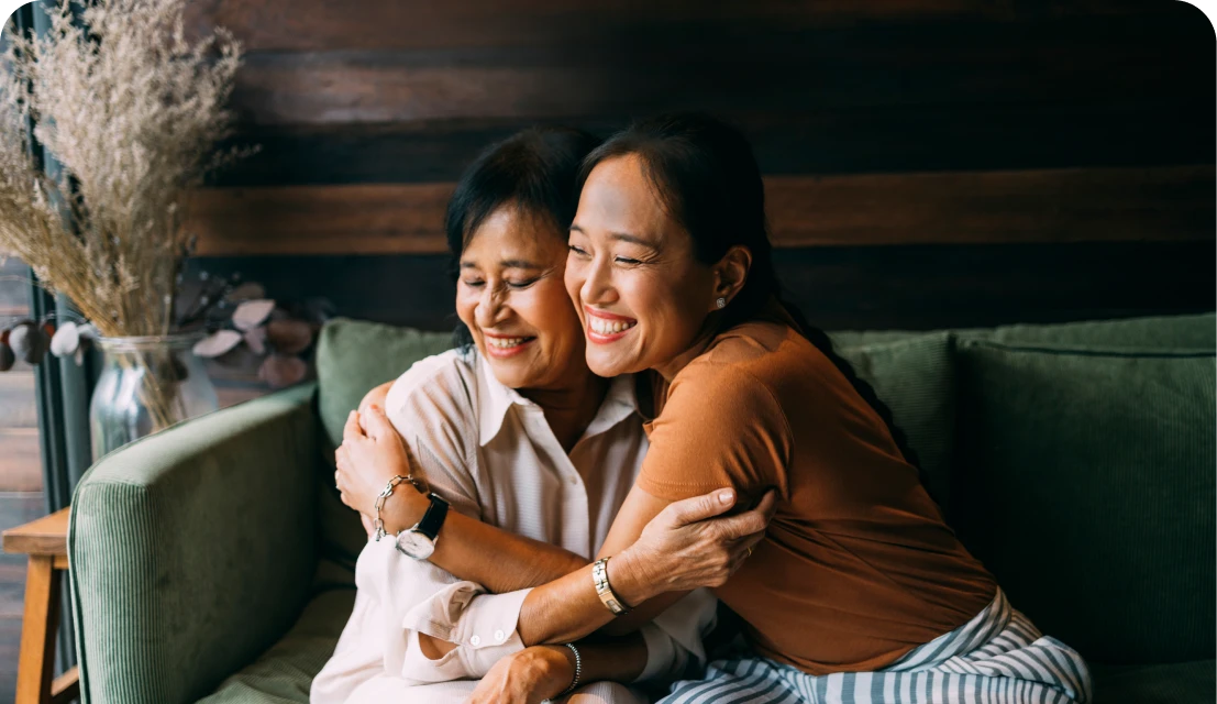Mother and daughter embracing joyfully