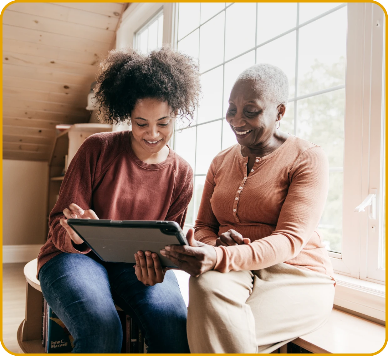 Smiling women looking at a tablet